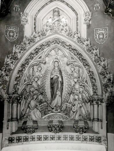 Mary emblems are visible on wall of the Lady Chapel in this photo from 1957 before they were painted over